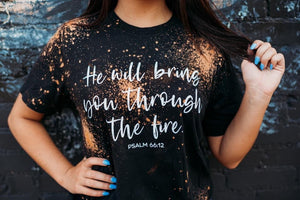 Acid washed “He will bring you through the fire” black tee